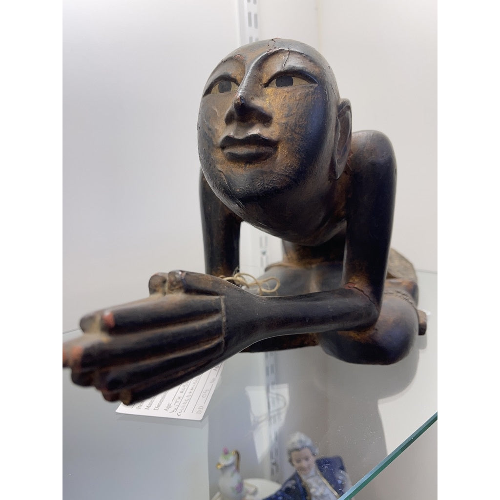 Carving of praying man