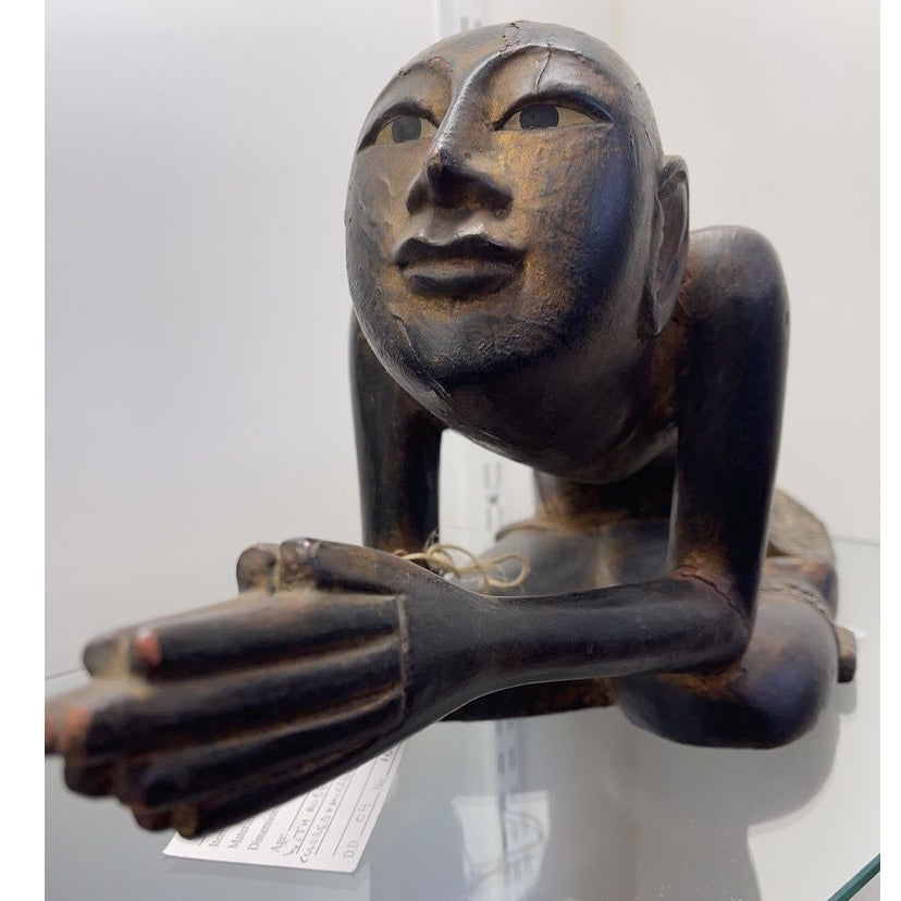 Carving of praying man